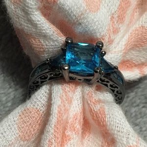 Black metal and blue stone ring